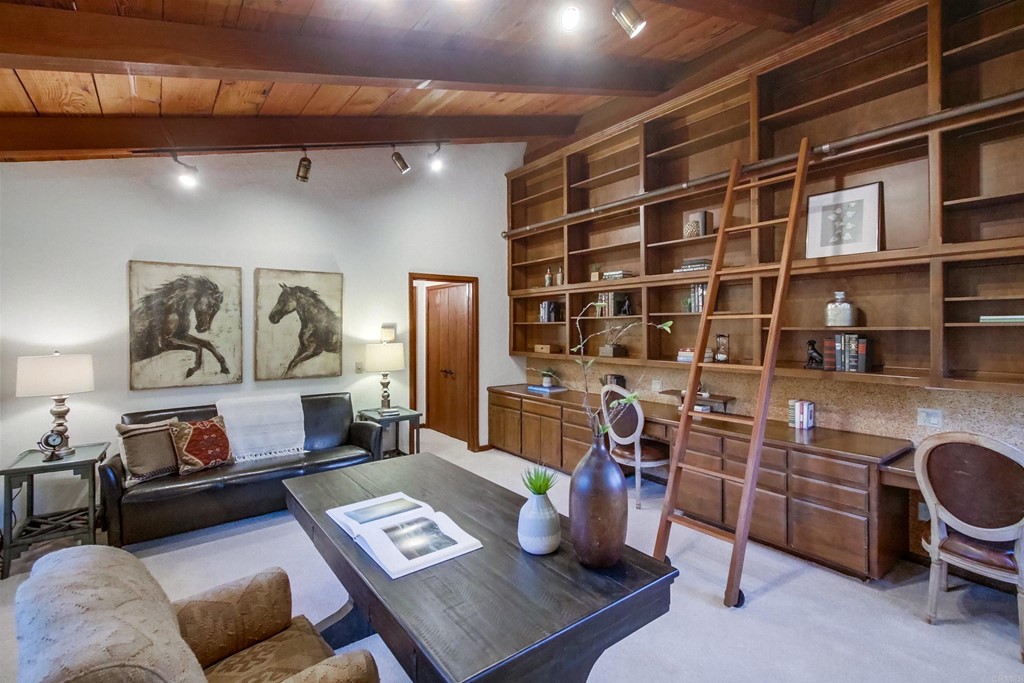 1256 Rancho Encinitas Drive Encinitas, CA 92024 - Photo 14 of 28 a living room with furniture and a book shelf