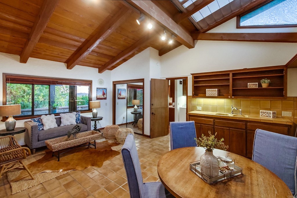 1256 Rancho Encinitas Drive Encinitas, CA 92024 - Photo 18 of 28 a living room with furniture and a wooden floor