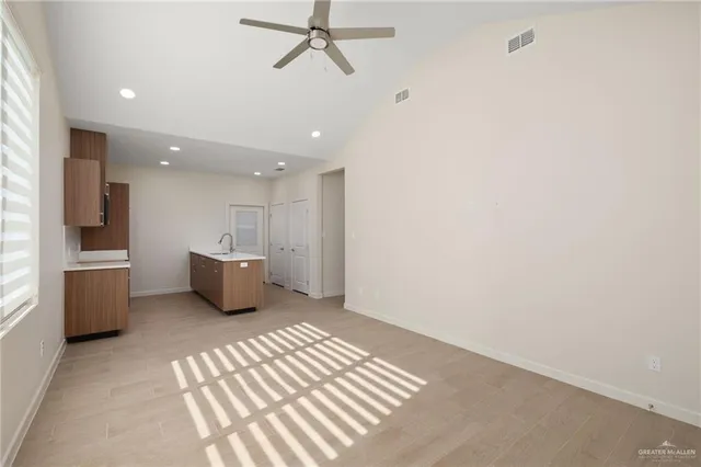 a view of a hallway with a kitchen