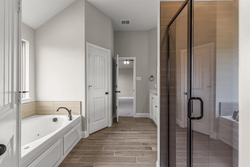 314 Pennington Road Josephine, TX 75173 - Photo 14 of 37 a bathroom with a bathtub and a shower