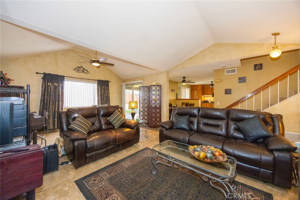 1907 Pepper Tree Lane East Colton, CA 92324 - Photo 10 of 33 a living room with furniture couches and a flat screen tv
