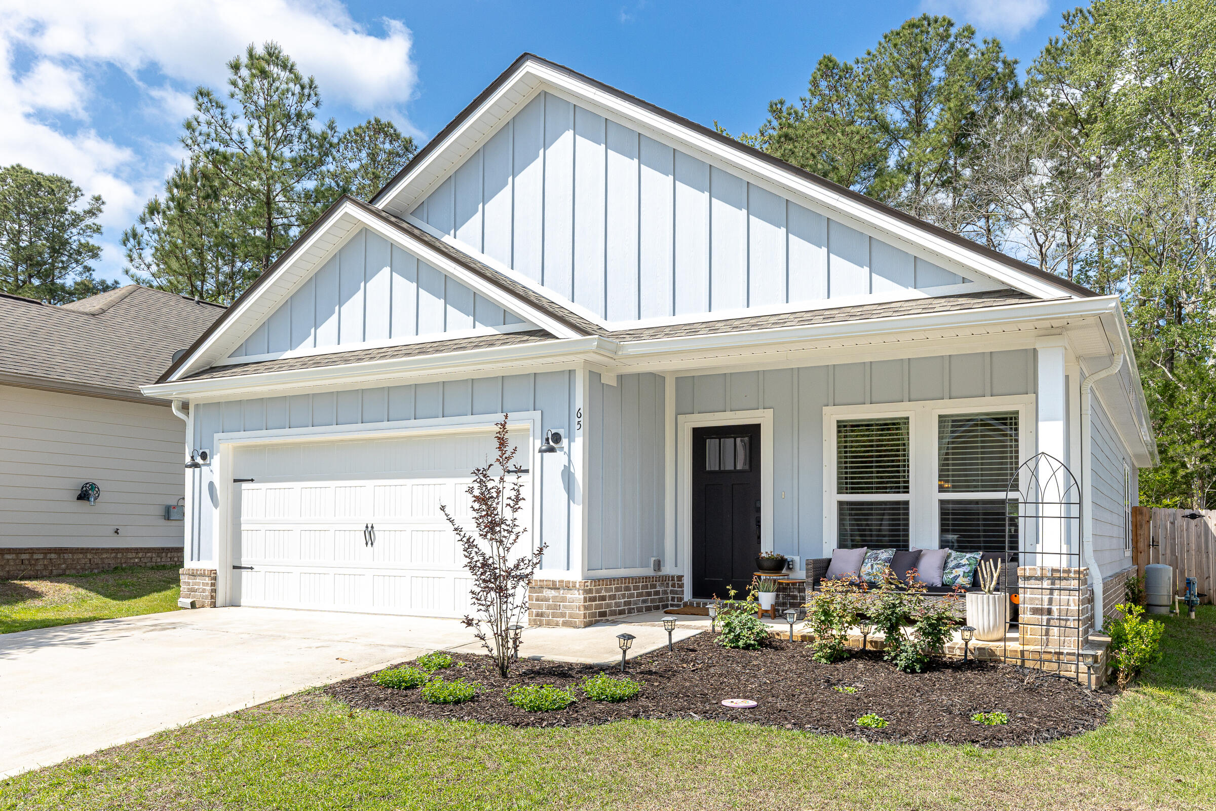 a front view of a house with garden