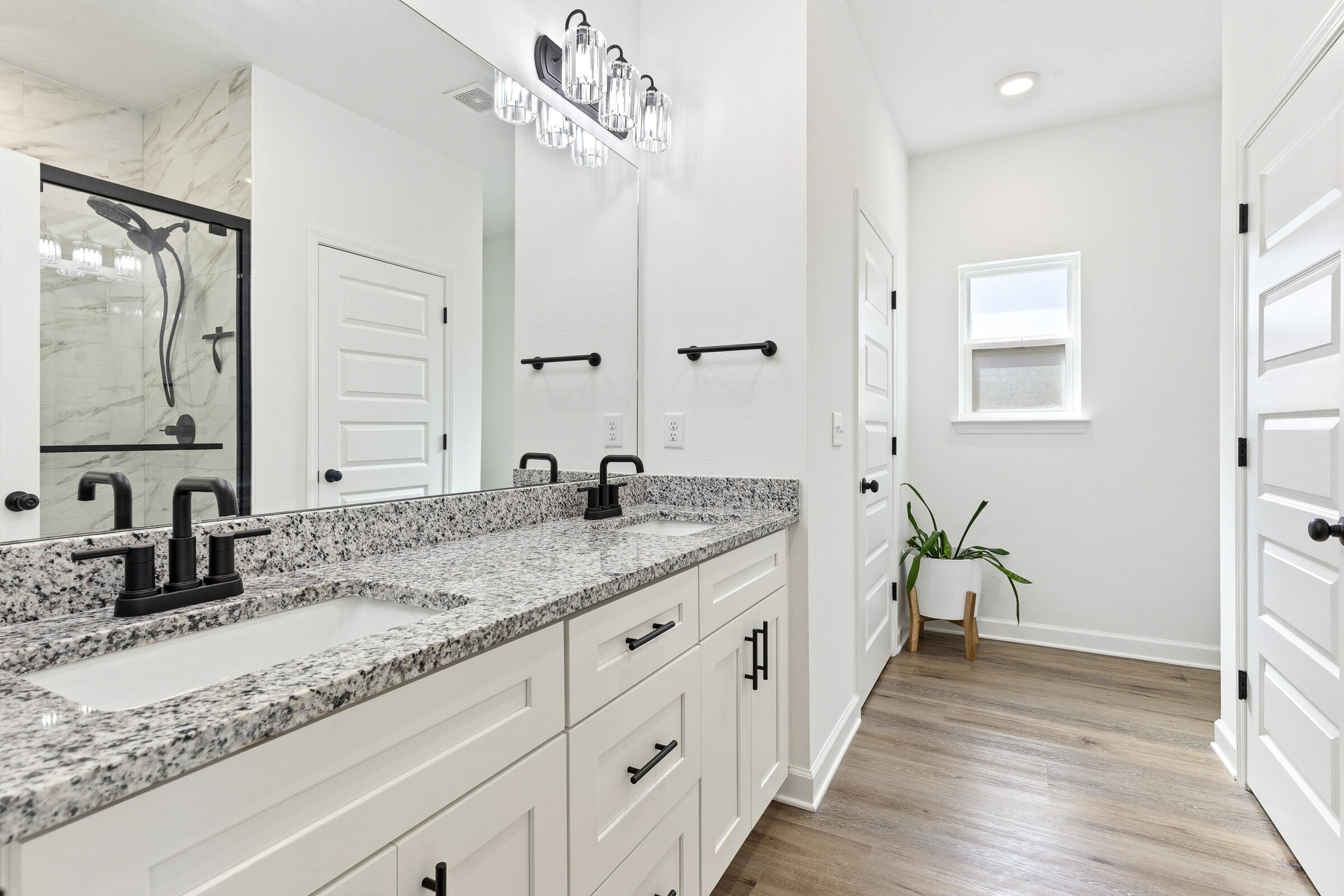 65 Marsh Landing North Freeport, FL 32439 - Photo 15 of 35 a bathroom with double vanity sinks and a mirror