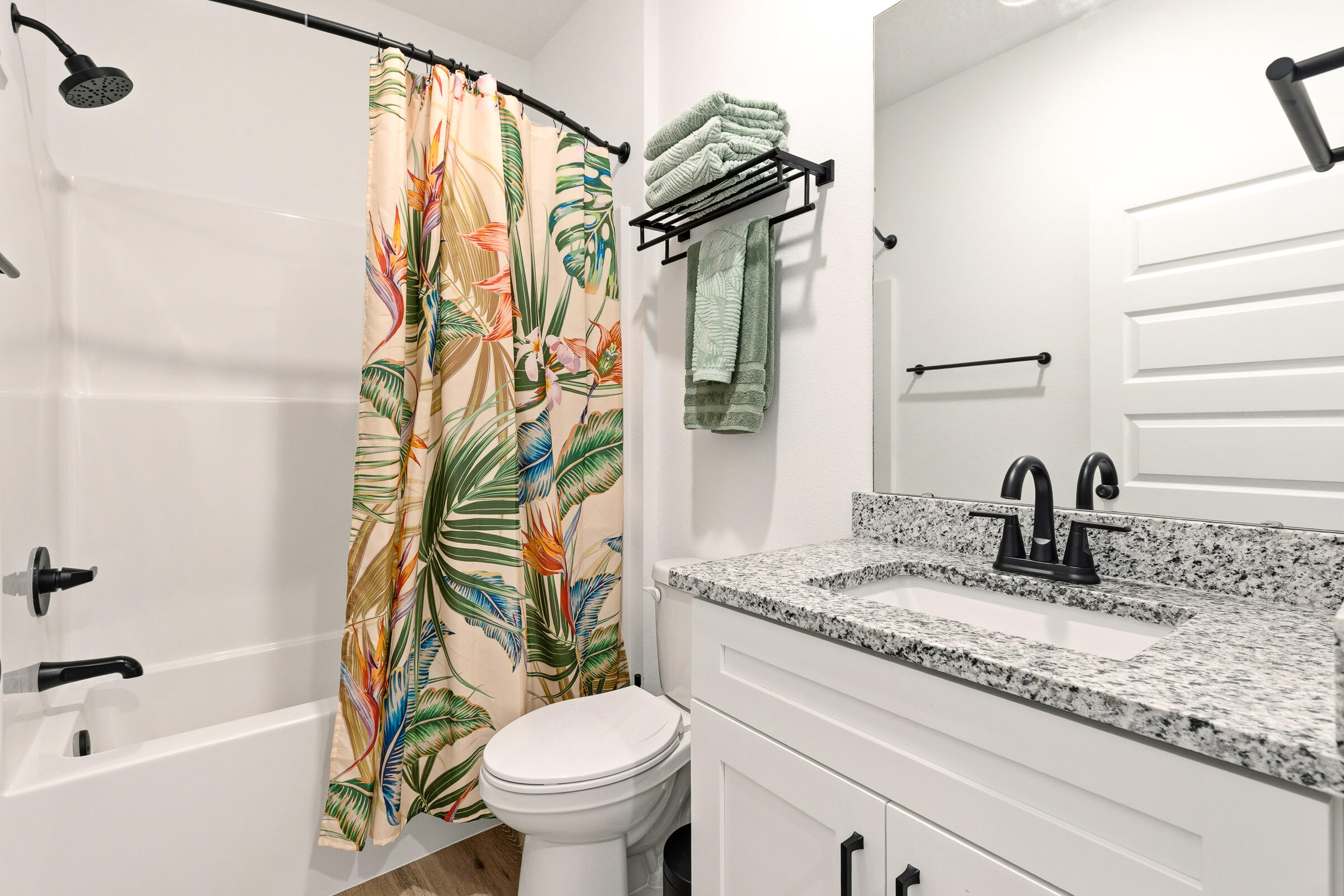 65 Marsh Landing North Freeport, FL 32439 - Photo 19 of 35 a bathroom with a granite countertop sink a toilet and a bathtub
