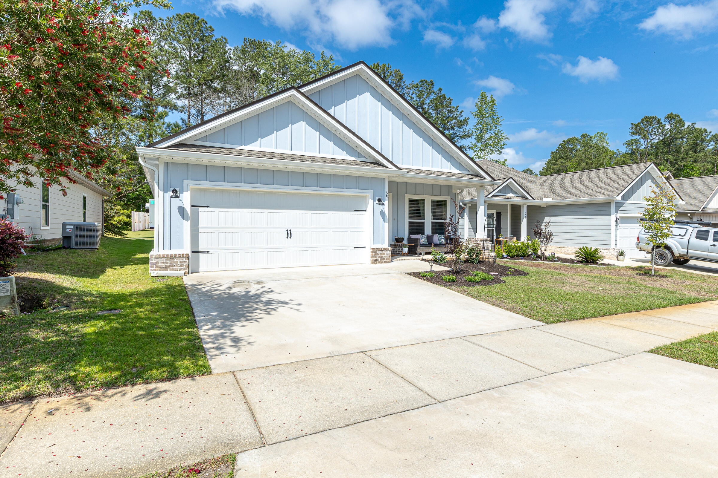 65 Marsh Landing North Freeport, FL 32439 - Photo 22 of 35 a front view of a house with a yard
