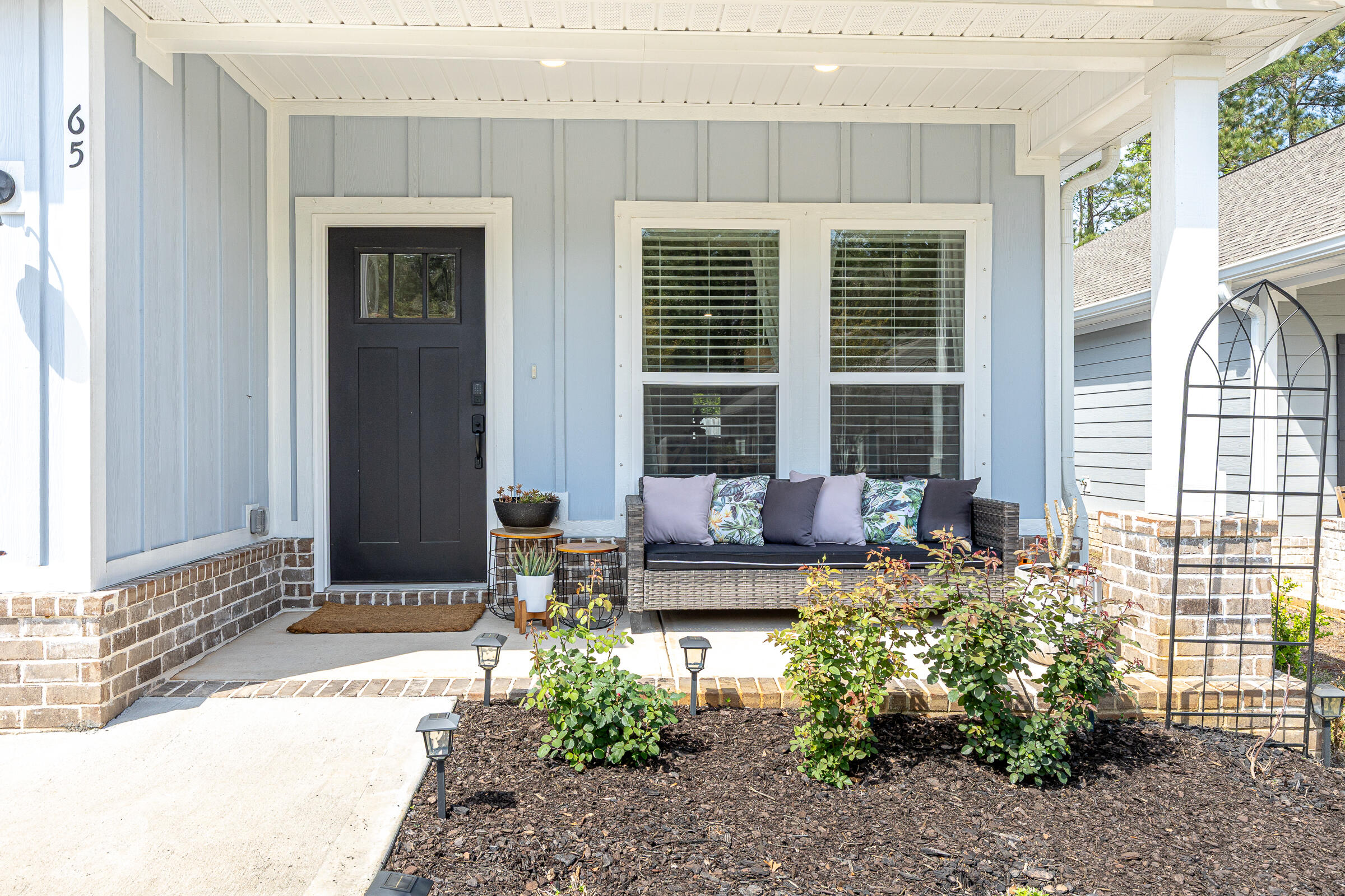 65 Marsh Landing North Freeport, FL 32439 - Photo 24 of 35 a front view of a house with outdoor seating