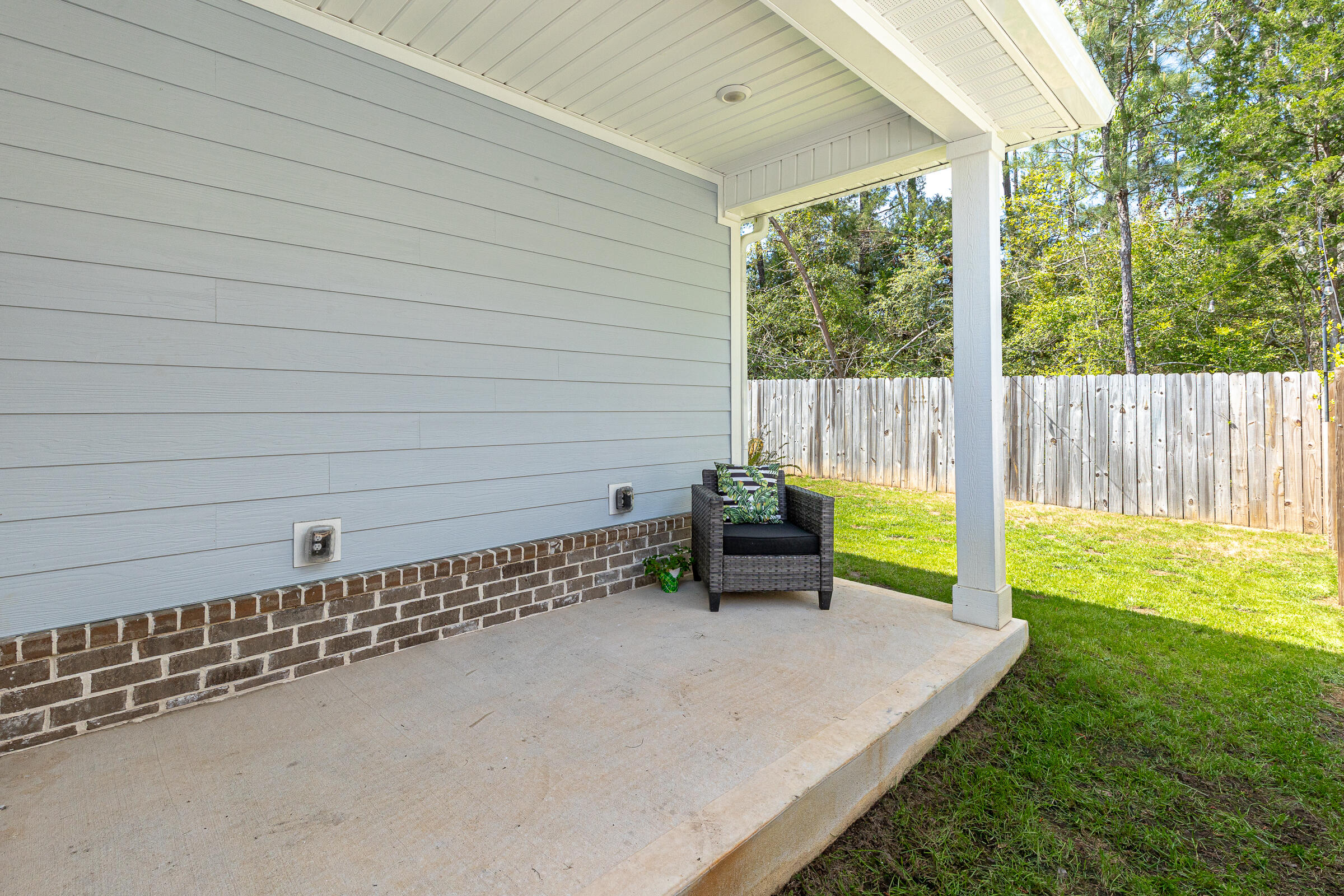 65 Marsh Landing North Freeport, FL 32439 - Photo 25 of 35 a view of a garden with an outdoor seating