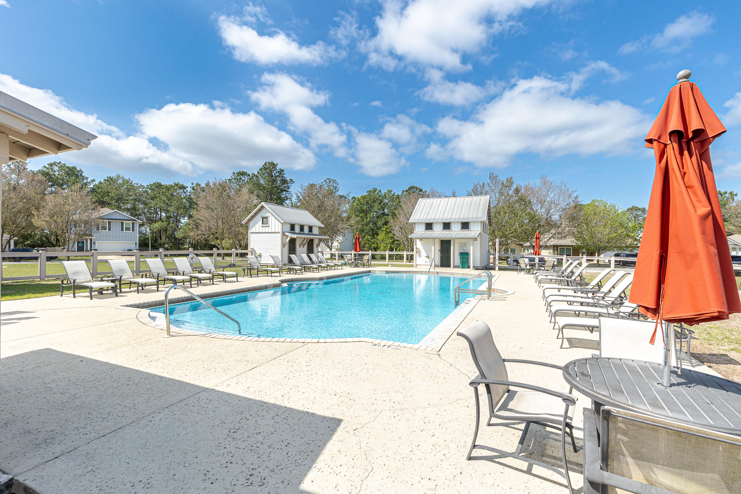 65 Marsh Landing North Freeport, FL 32439 - Photo 32 of 35 a view of a swimming pool with a lounge chairs