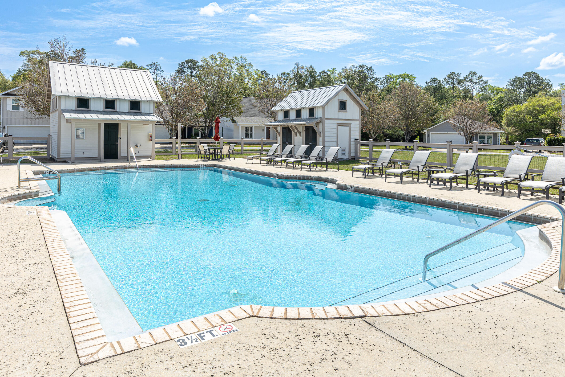 65 Marsh Landing North Freeport, FL 32439 - Photo 34 of 35 a view of a swimming pool with a lounge chairs