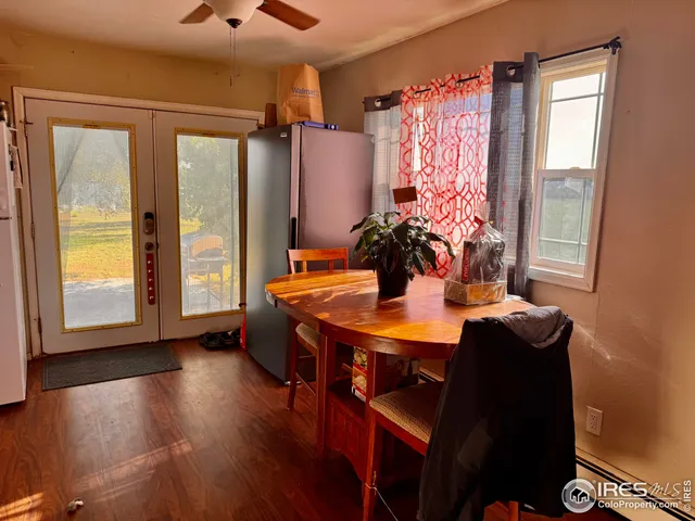 a dining room with a table and chairs