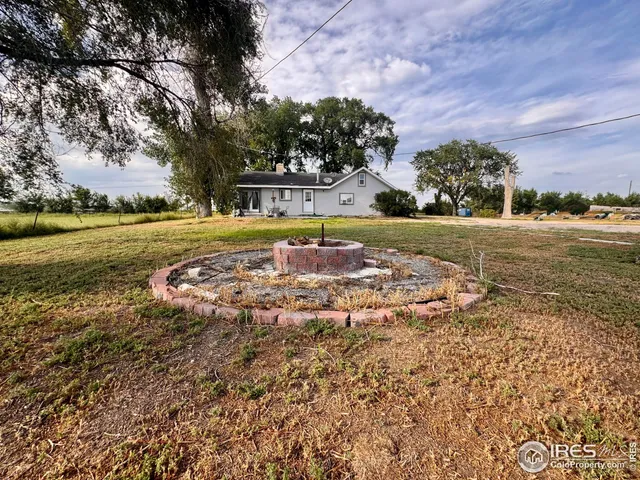 a view of a swimming pool with an outdoor space and seating area