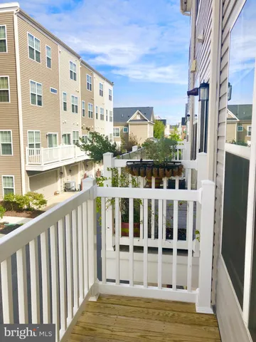 a view of balcony with furniture