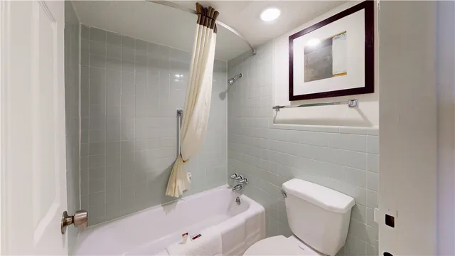 a bathroom with a toilet sink and tub