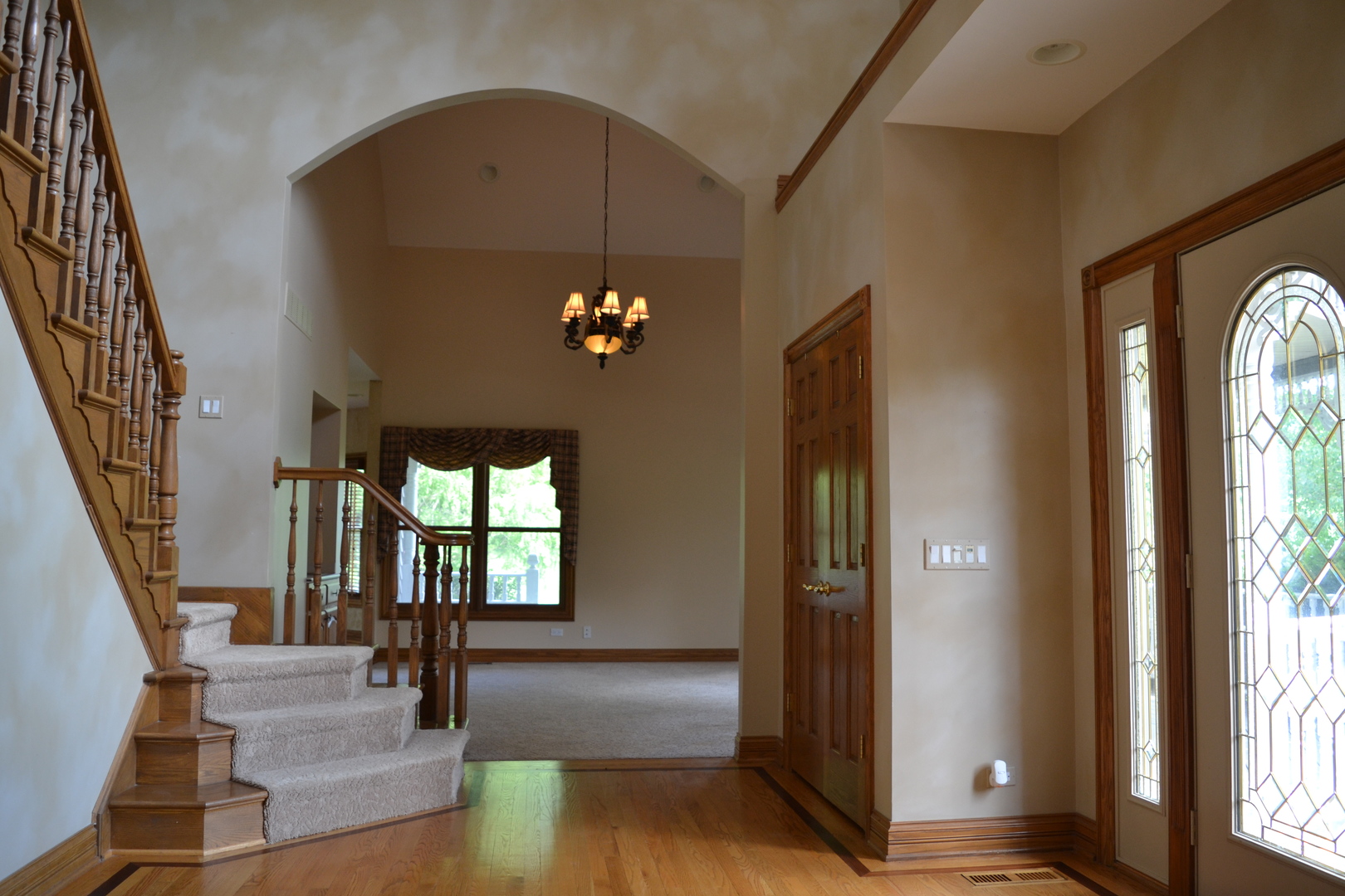9N313 Muirhead Road Elgin, IL 60124 - Photo 15 of 61 a view of an entryway with wooden floor door and a living room