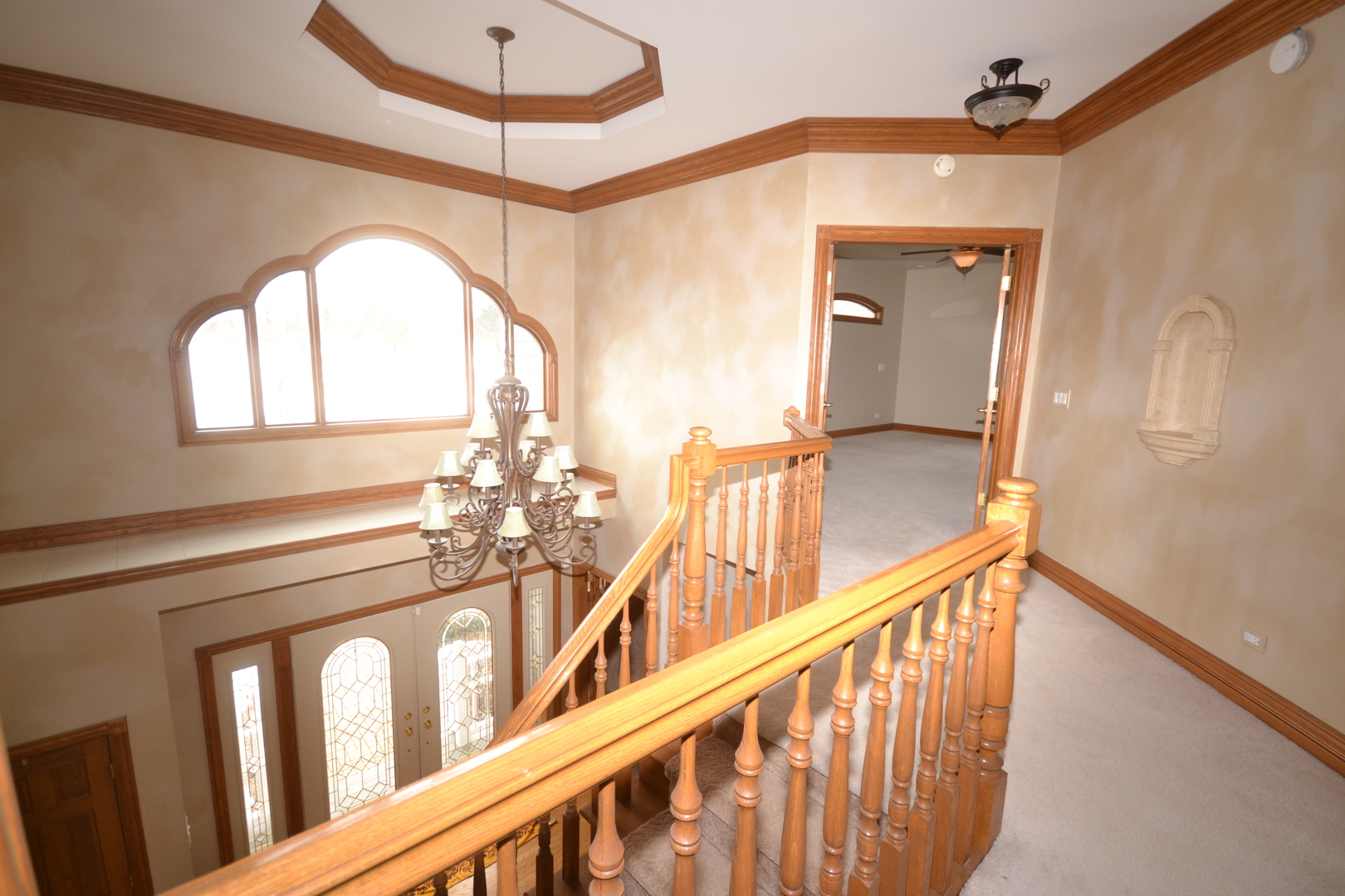 9N313 Muirhead Road Elgin, IL 60124 - Photo 29 of 61 a view of a hallway with wooden floor and windows