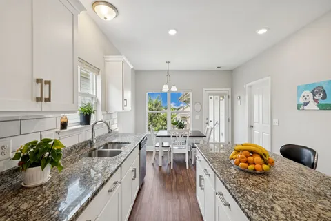 a kitchen with a table and chairs
