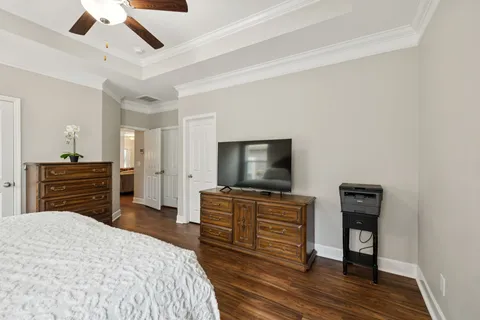 a bedroom with a bed and a television