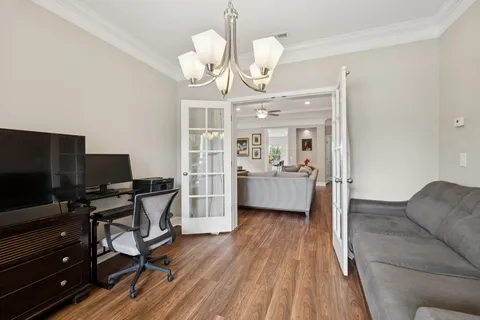 a view of a livingroom with furniture and a flat screen tv