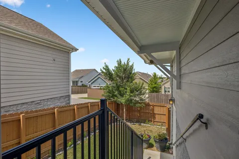 a view of balcony with furniture