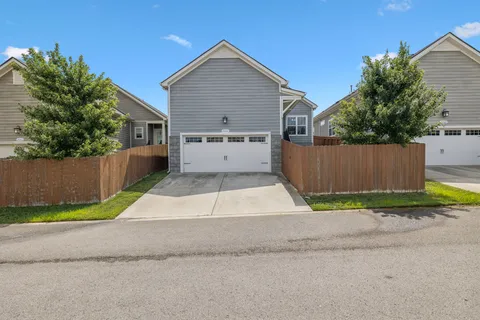 a house view with a backyard space