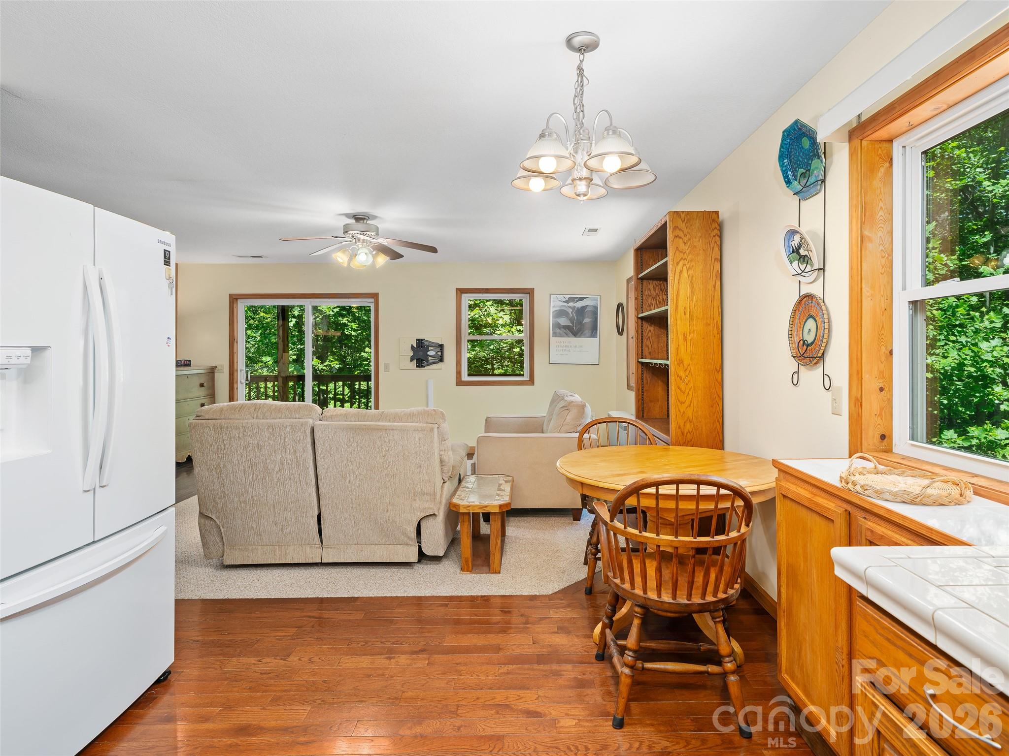 142 Wildflower Road Spruce Pine, NC 28777 - Photo 10 of 46 a view of a dining room with furniture and a chandelier