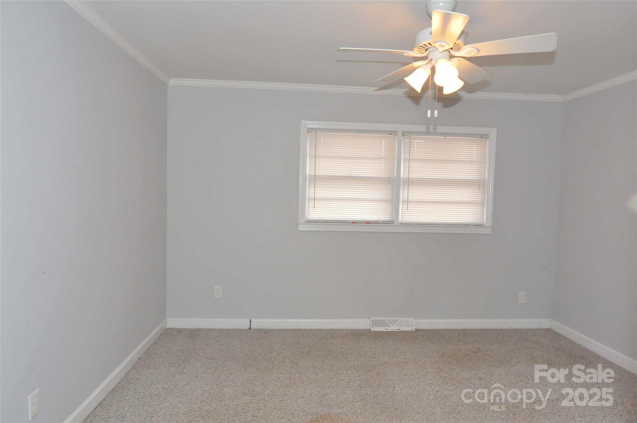 378 Center Street, Unit 1 Chester, SC 29706 - Photo 25 of 28 an empty room with windows and fan