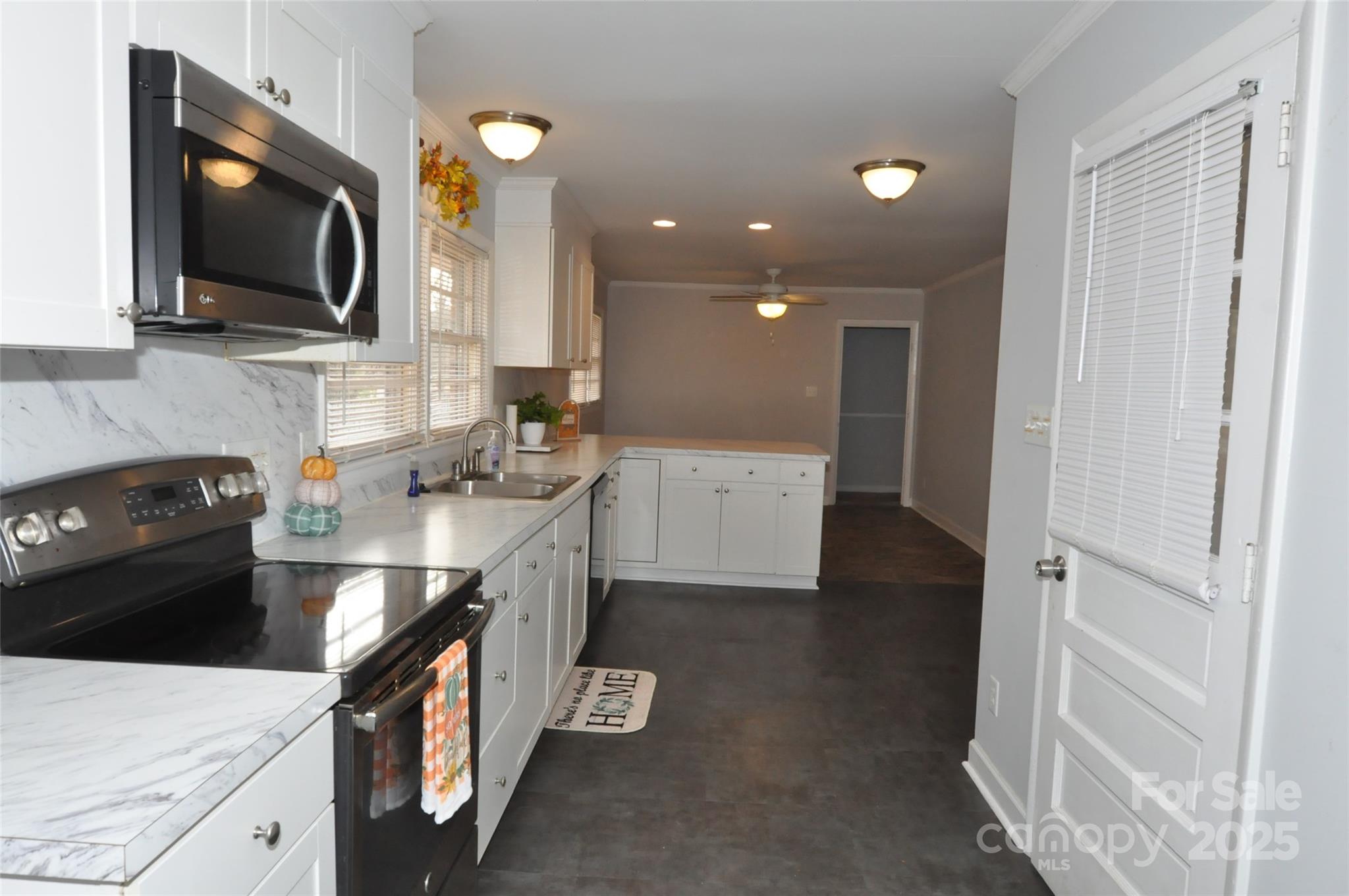 378 Center Street, Unit 1 Chester, SC 29706 - Photo 9 of 28 a kitchen with a sink stove and microwave