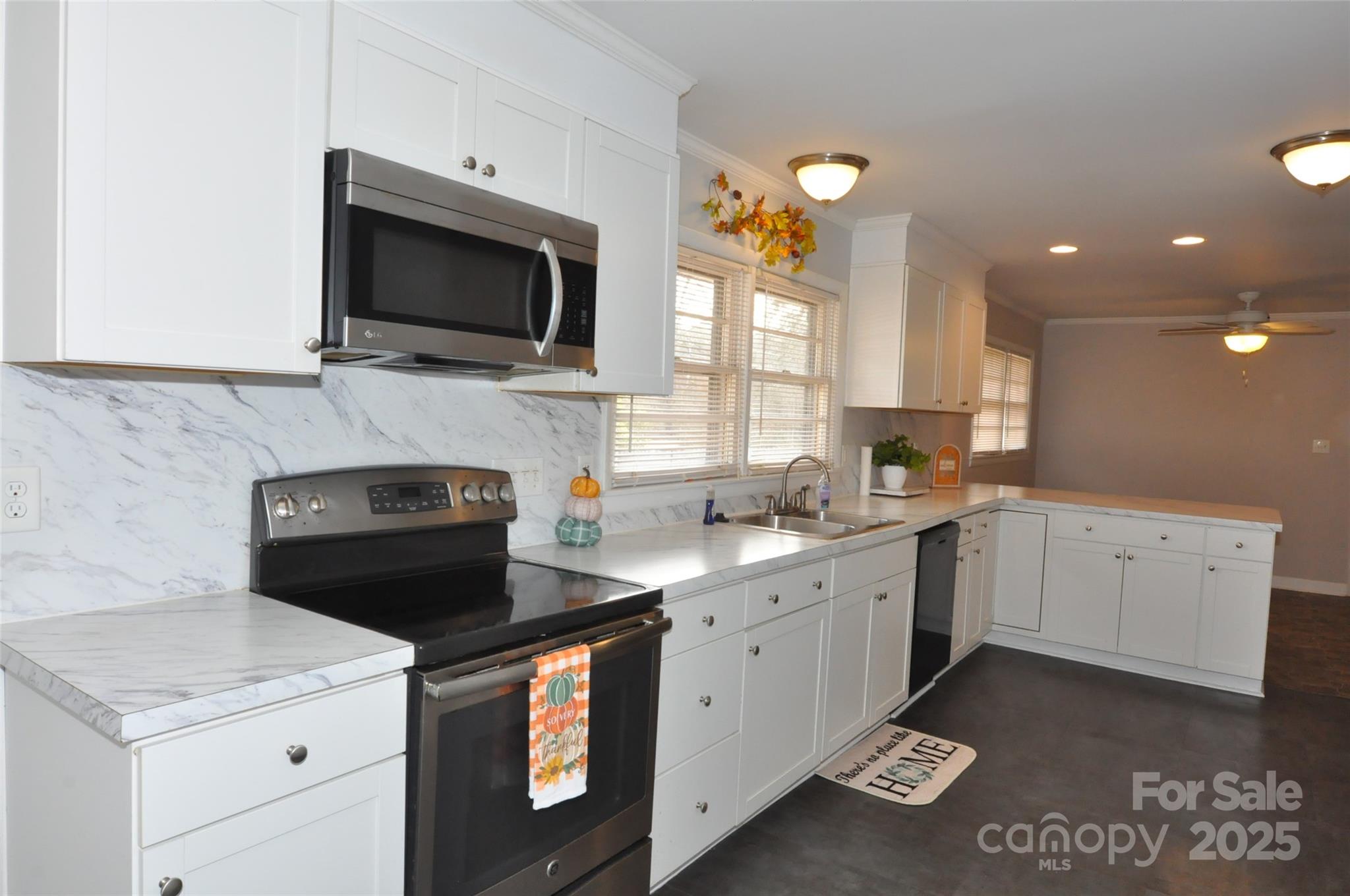 378 Center Street, Unit 1 Chester, SC 29706 - Photo 10 of 28 a kitchen with a stove and a microwave