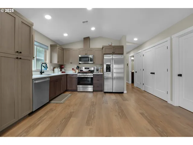 a view of kitchen with wooden floor