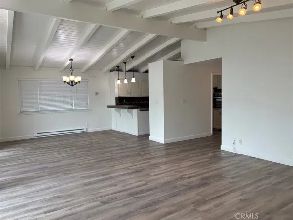 a view of a livingroom with wooden floor