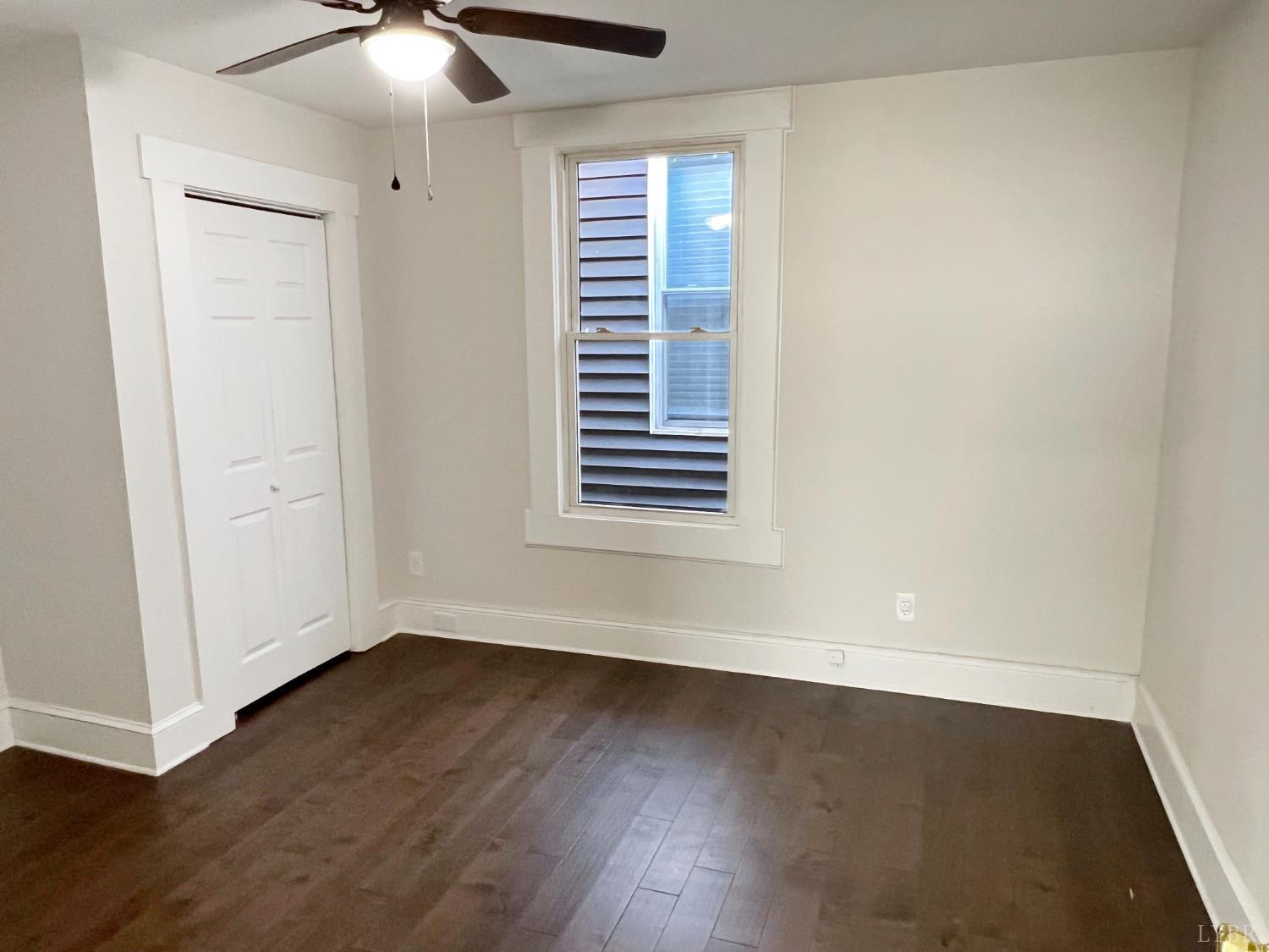 2927 Langhorne Road Lynchburg, VA 24501 - Photo 12 of 19 an empty room with wooden floor and windows
