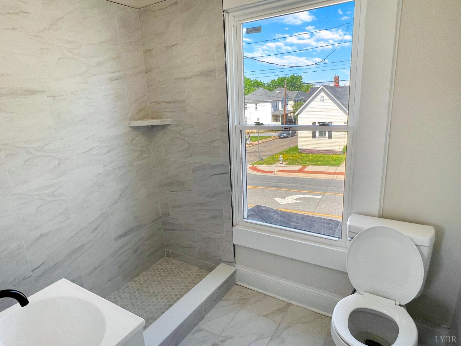 2927 Langhorne Road Lynchburg, VA 24501 - Photo 16 of 19 a bathroom with a toilet and a shower