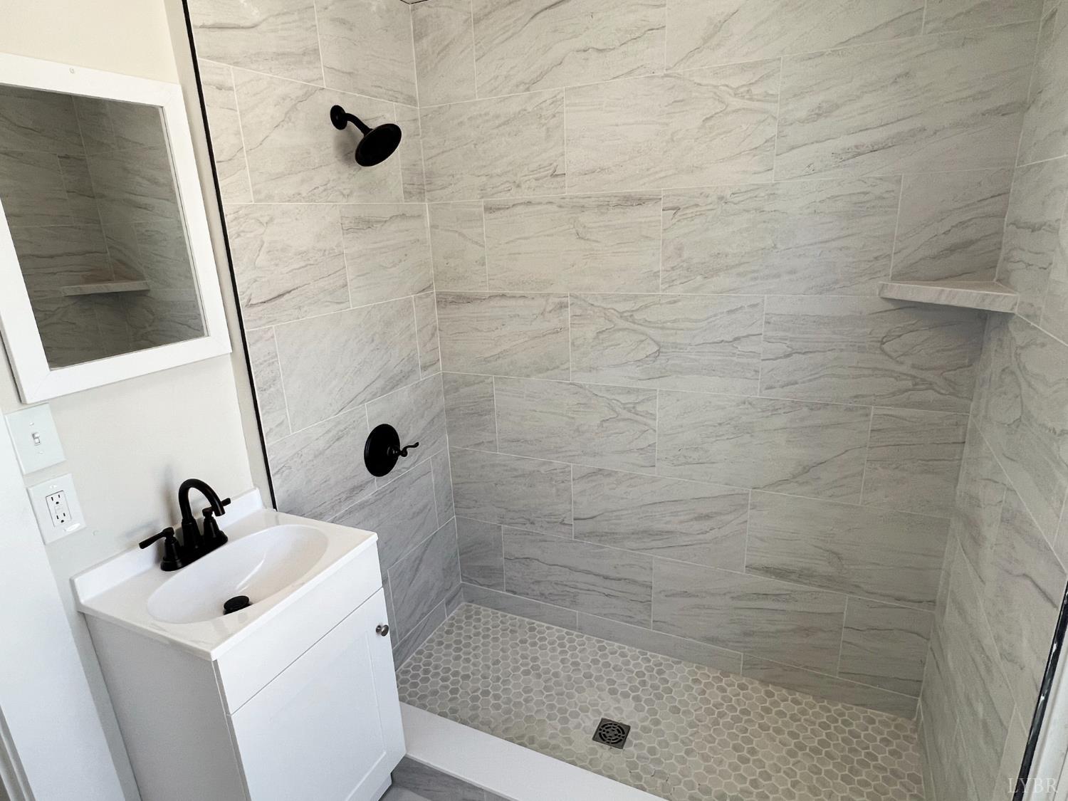 2927 Langhorne Road Lynchburg, VA 24501 - Photo 17 of 19 a bathroom with a sink and a shower