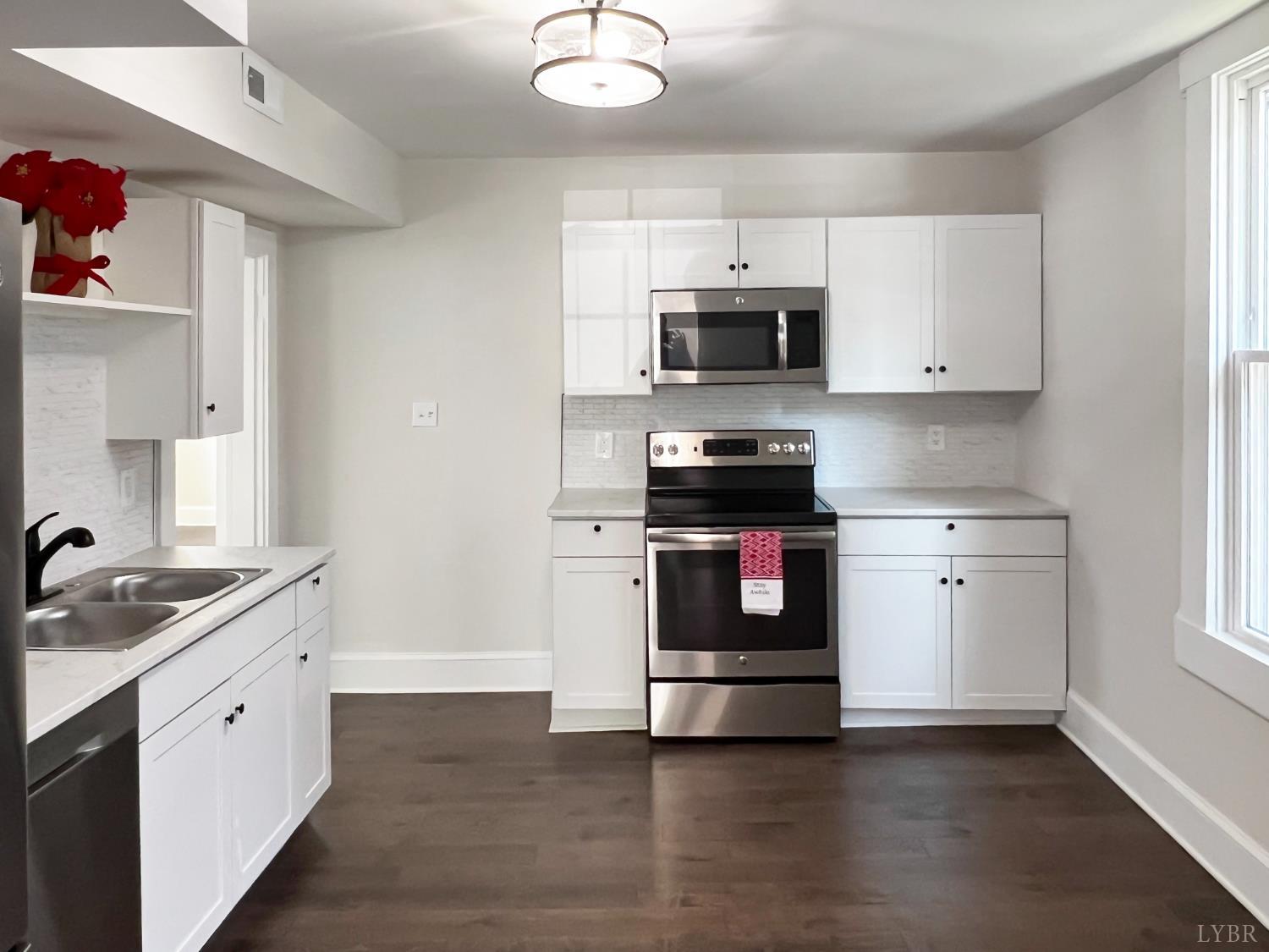 2927 Langhorne Road Lynchburg, VA 24501 - Photo 7 of 19 a kitchen with stainless steel appliances white cabinets and a sink
