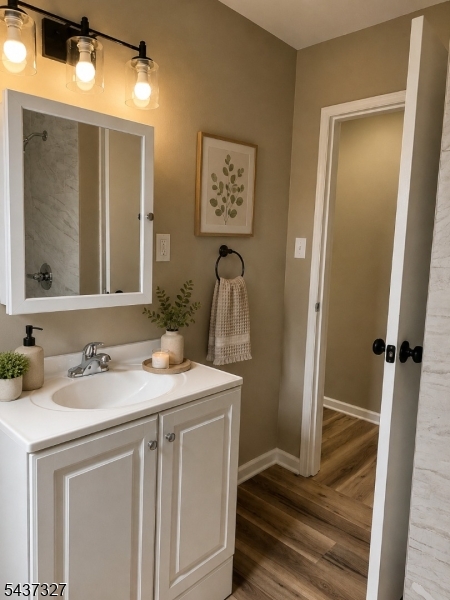 255 Main Street Madison, NJ 07940 - Photo 7 of 9 a bathroom with a sink and a mirror