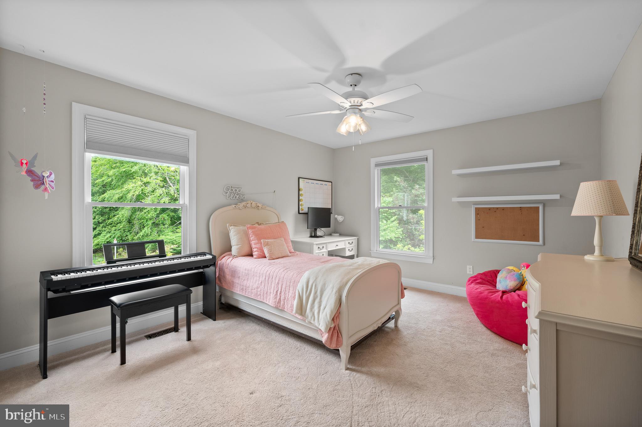 704 Turnbridge Road Wayne, PA 19087 - Photo 28 of 64 a bedroom with a bed and a chandelier