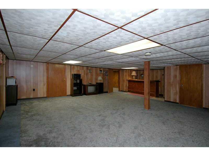 300 Gass Road Pittsburgh, PA 15229 - Photo 15 of 25 Basement/Game Room. The finished game room comes complete with a bar area, full bath and plenty of space for a variety of indoor recreation.