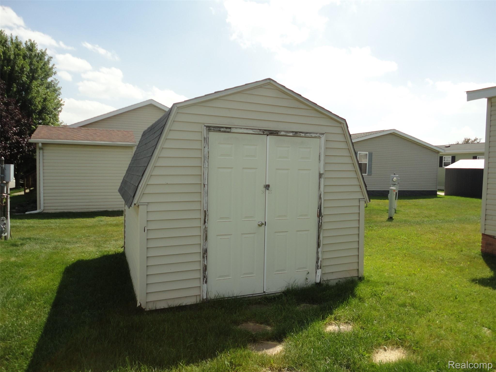 3954 Ryans Ridge Monroe, MI 48161 - Photo 5 of 28 Exterior storage shed with double doors and horizontal siding