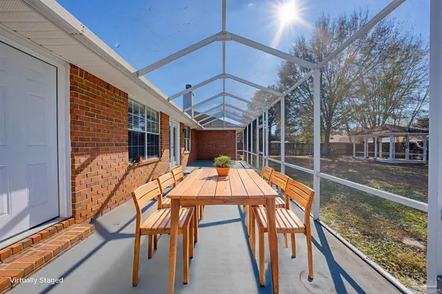 a view of a house with backyard and porch