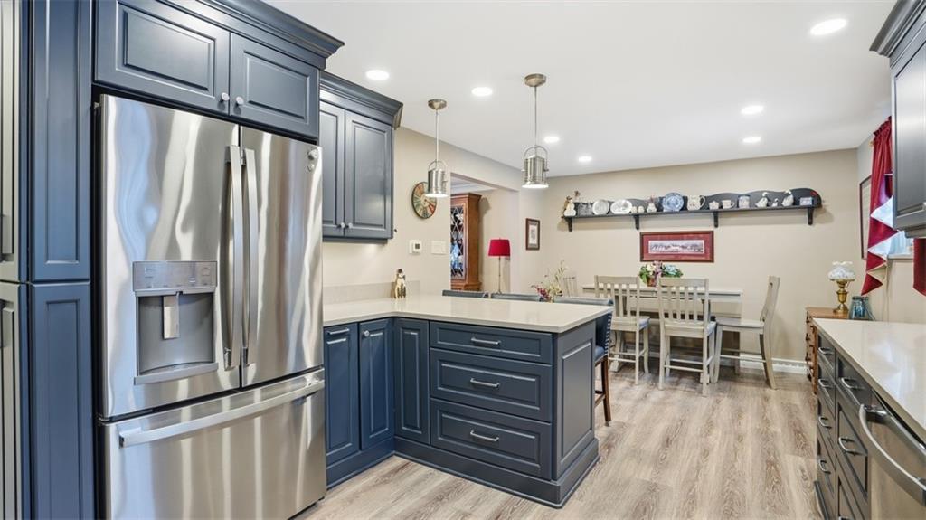 6142 Penn Drive Butler, PA 16002 - Photo 12 of 34 a kitchen with stainless steel appliances granite countertop a refrigerator and a stove top oven