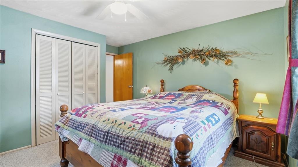 6142 Penn Drive Butler, PA 16002 - Photo 18 of 34 a bedroom with a bed and a painting on the wall