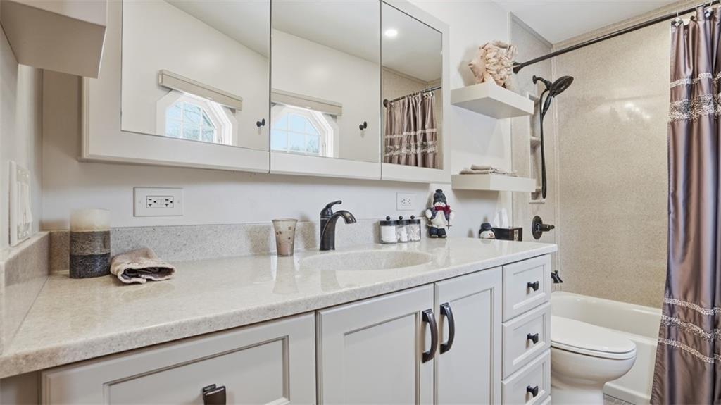 6142 Penn Drive Butler, PA 16002 - Photo 22 of 34 a kitchen with cabinets stainless steel appliances a sink and a counter top space
