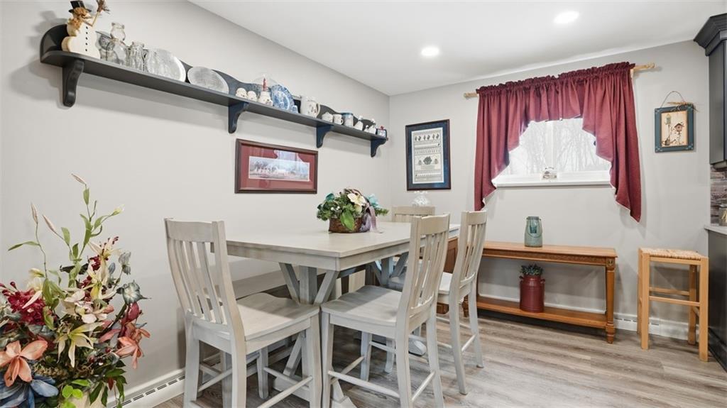 6142 Penn Drive Butler, PA 16002 - Photo 7 of 34 a view of a dining room with furniture and wooden floor