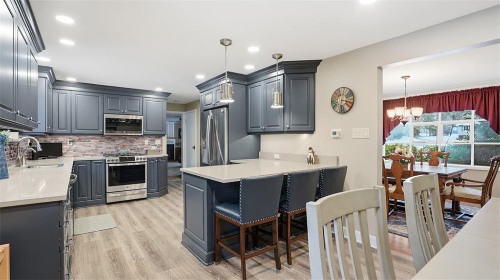 6142 Penn Drive Butler, PA 16002 - Photo 8 of 34 a large kitchen with a table and chairs in it