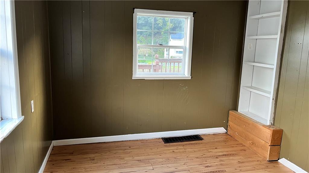 402.5 North 10th Street Apollo, PA 15613 - Photo 2 of 9 a view of an empty room with wooden floor and a window