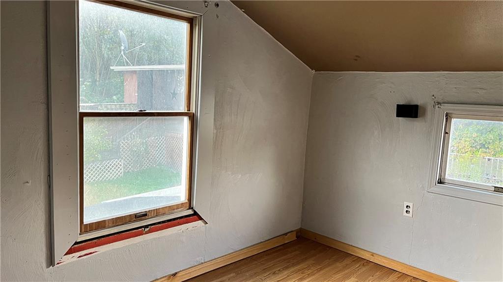 402.5 North 10th Street Apollo, PA 15613 - Photo 6 of 9 a view of an empty room with wooden floor and a window