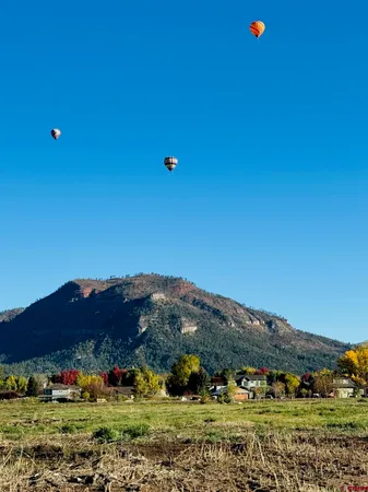 a view of a town with mountains in the background