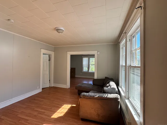 a living room with furniture and a window