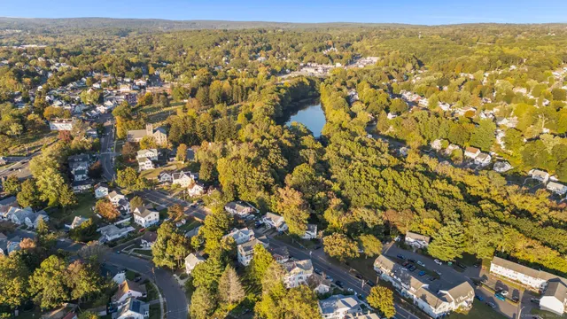 an aerial view of residential houses with outdoor space