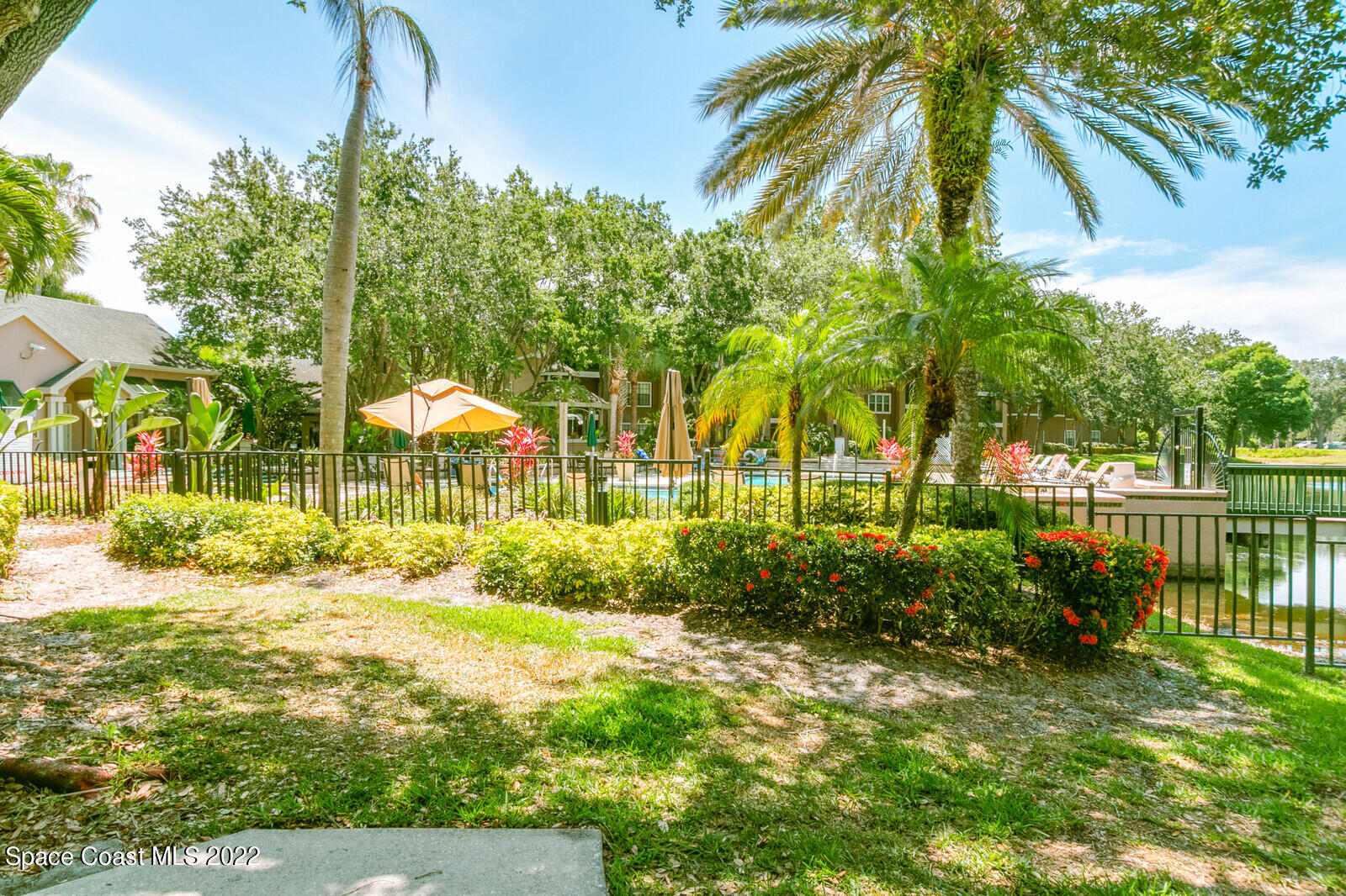7667 North Wickham Road, Unit 418 Melbourne, FL 32940 - Photo 20 of 36 a view of backyard with outdoor and swimming pool